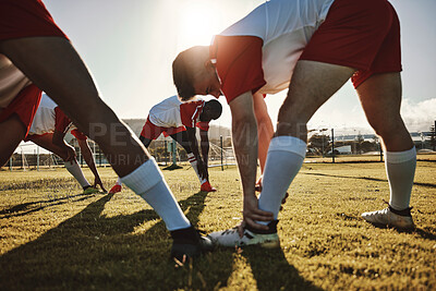 Buy stock photo Stretching, legs and men at soccer training on a field for fitness, cardio exercise and sports collaboration. Team of football players doing a warmup before a game of sport at a park in summer