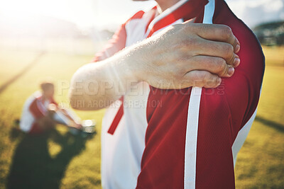 Buy stock photo Soccer, athlete and shoulder pain with an injury from a sports match or training on a field. Fitness, football and man with a medical emergency of muscle, joint or bone sprain during an exercise.