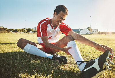 Buy stock photo Soccer, athlete and injury on sport field while exercise, workout and practice suffer on game day. Football, health and painful leg from training, sore or muscle for stretching, fallen or foot pain
