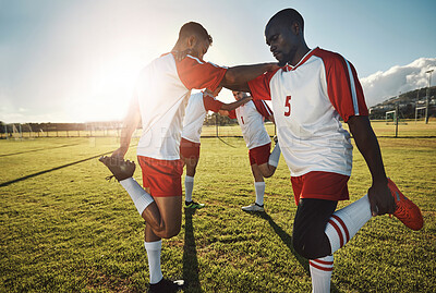 Buy stock photo Soccer, men stretching on field and team support before sports game or training exercise. Health, fitness and teamwork, football competition players stretch on grass together before sunset workout