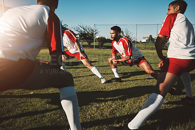 Buy stock photo Soccer field, men and team stretching legs for match warm up, practice or game. Sports, football and group stretch outdoors on pitch in preparation for exercise, training or fitness workout on grass.