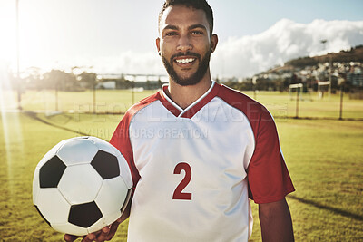 Buy stock photo Portrait, soccer player and man with a soccer ball at a field, happy, smile and excited about sports goal at soccer field. Football player, fitness and guy at a football field for training workout