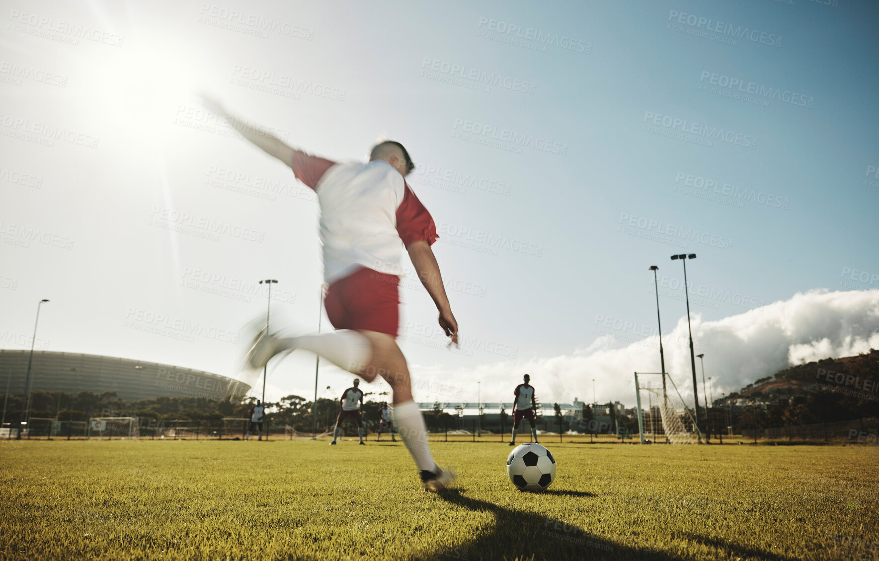 Buy stock photo Motion blur, soccer field and man kick ball to player on stadium pitch in sports competition game to score goals, winning and fitness. Football athlete action, energy or dynamic shot outdoor training