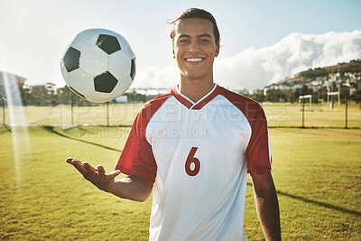 Buy stock photo Soccer, portrait and man on a field for training, sports or game in summer. Happy, excited and young athlete catching a football during exercise, fitness and cardio on a sport ground in a park
