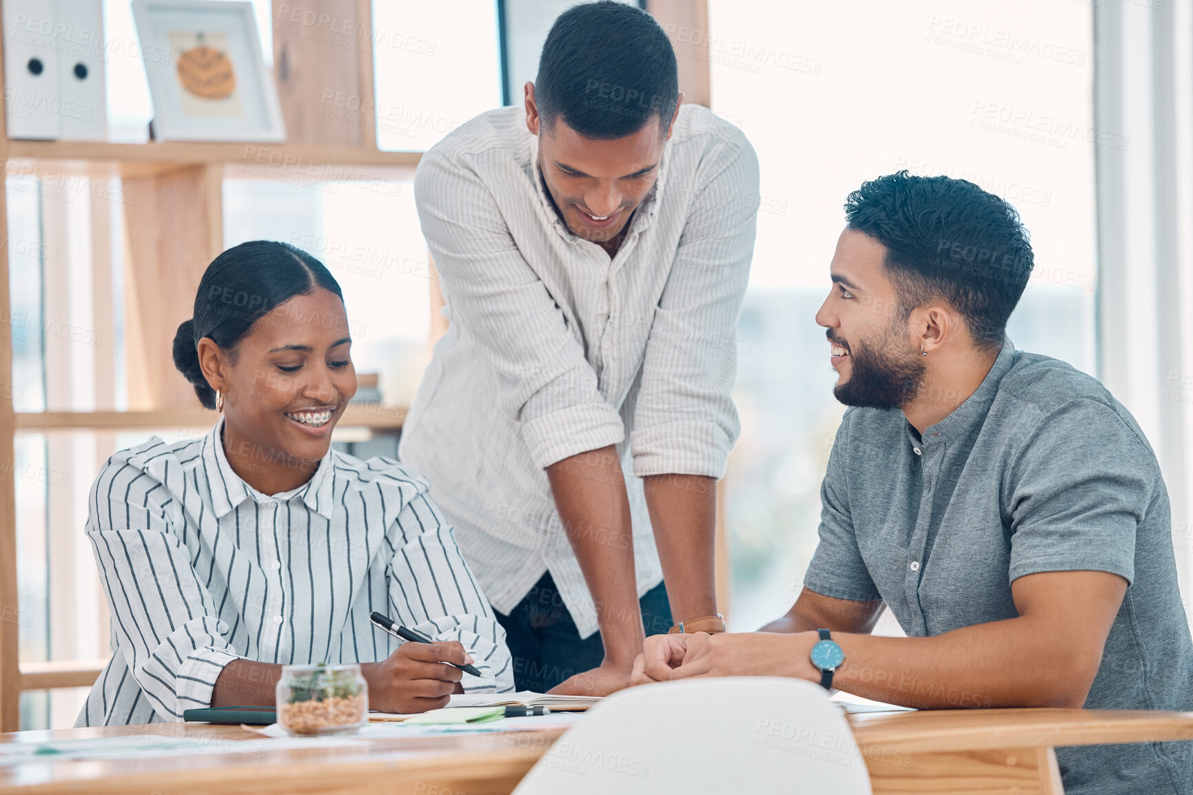 Buy stock photo Strategy, teamwork and young business people in a meeting in creative workspace. Diversity, working and happy team brainstorming ideas, design and planning for startup company in business meeting