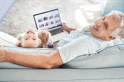 Buy stock photo Portrait of relax grandfather, child and laptop with digital photo album, memory gallery and enjoy quality time together. Love, happy family bond or senior man with kid girl smile on living room sofa