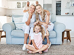 Love, grandparents and portrait of family on a sofa with smile of their face. Grandmother, mom and girl sitting on couch in living room posing for picture together. Happy big family bond with parents