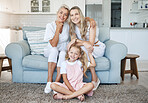 Mom, child and grandmother portrait on sofa for female generations in happy family relaxing. Love, care and bond of  women relatives with smile at living room couch together at home in Canada.