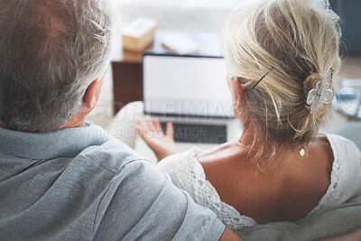 Buy stock photo Couple, retirement and pensioner with a senior man and woman watching tv on a laptop in their living room together. Love, entertainment and bonding with an elderly husband and wife streaming online