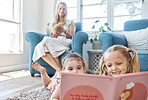 Development, mother and girl children doing reading with book, smile and happy on floor, together and home. Female, lady and daughters doing childcare, growth and fun, laugh or education for learning