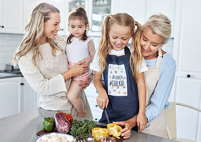 Buy stock photo Family, cooking and vegetables, women and girl together in kitchen, spending quality time and bonding. Mother, daughter and grandmother, fresh and healthy food, nutrition and life skill development.