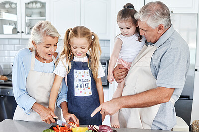 Buy stock photo Cooking, smile and grandparents teaching children to cook food together in the kitchen of their house. Happy and young kids learning and helping an elderly man and woman with healthy lunch or dinner