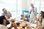 Family, lunch and happy, applause for food and drink, thank you and together in family home in Australia. Grandparents, parents and child eating, nutrition and spending quality time near the ocean.