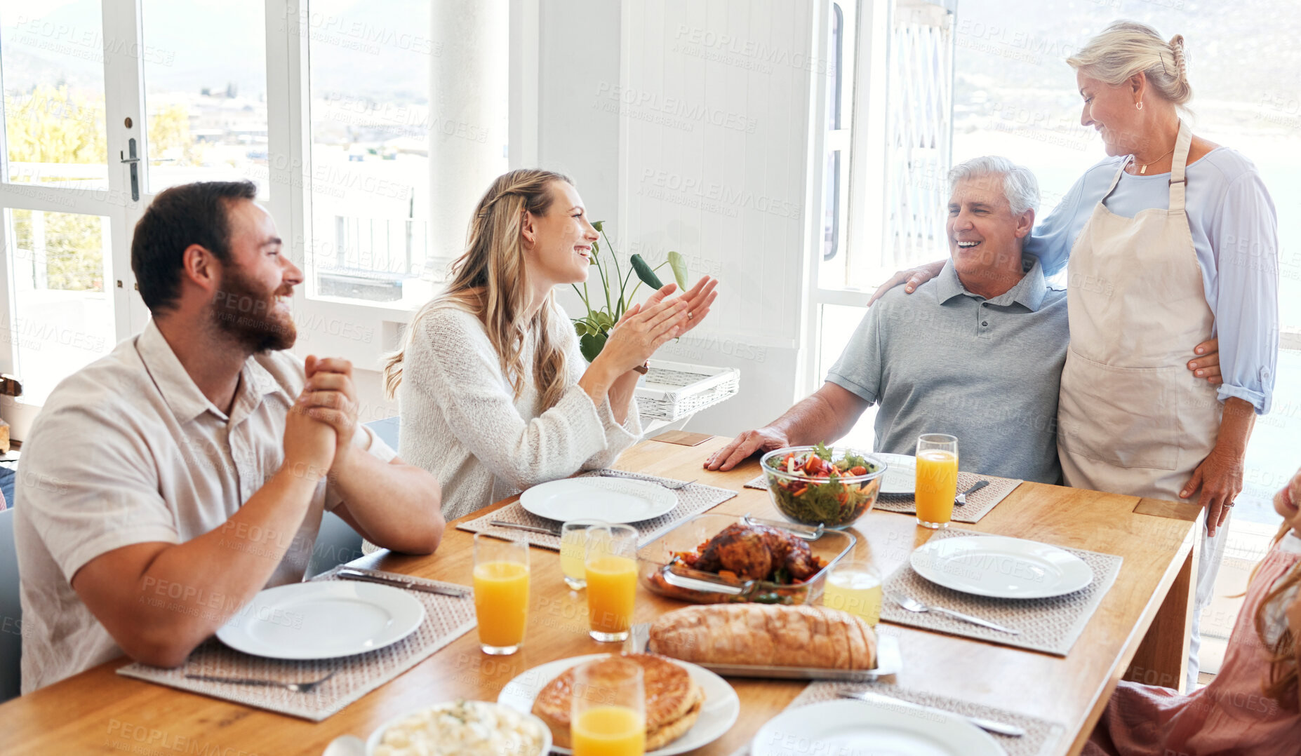 Buy stock photo Food, relax and happy with family at table for lunch, love and smile together in dining room. Eating, holiday and dinner for celebration with couple and parents for retirement, peace and lifestyle