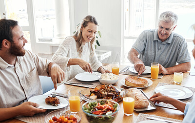 Buy stock photo Lunch, family home celebration and grandparents hosting a dinner at kitchen table with smile, food or breakfast. Couple, food and senior people eating meal together with love in their happy house