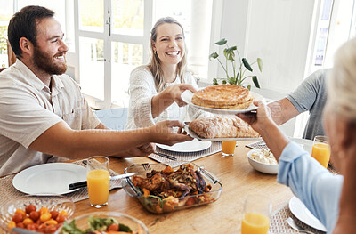Buy stock photo Big family, lunch and food in home dining room with people sharing a meal. Love, happy and relatives eating food, bread and delicious gourmet chicken on table while spending quality time together.