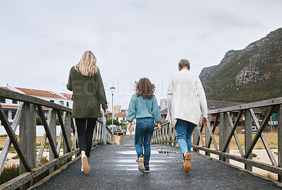 Buy stock photo Family, walking and bridge in nature by mountain together on holiday, vacation and relax. Group, people and walk for bonding, time and love with kid, mother and grandmother on travel to Norway
