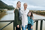 Portrait of grandmother, mother and girl on bridge happy and enjoying family vacation, Travel, journey and adventure with parents, kid and grandparents standing by lake on holiday, travelling and joy