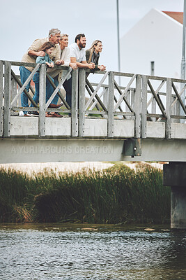 Buy stock photo Family, happy and bridge while standing by river together on holiday, vacation and relax in nature. Group, people and water for bonding, time and love with kids, parents and grandparents in Norway