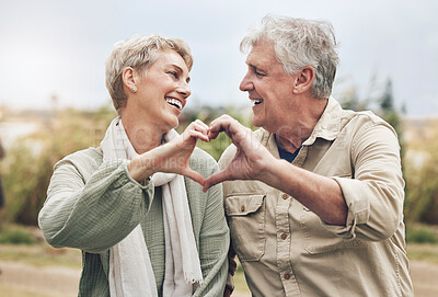 Buy stock photo Love, heart sign and senior couple with marriage happiness, healthy and wellness lifestyle in countryside. Elderly people man, and woman with loving hands in park or nature retirement holiday