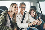 Phone, selfie and happy family in a car for a road trip driving or traveling to a holiday vacation adventure together. Grandma, mother and excited girl or child enjoy pictures for a fun weekend 