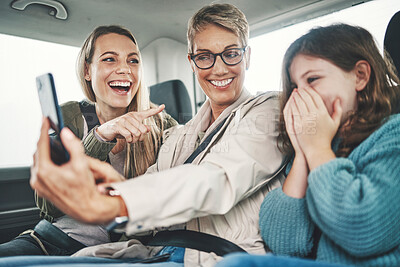Buy stock photo Phone, road trip or travel with a family selfie of a girl, mother and grandmother in a car for a holiday or vacation. Bonding, photograph and transport with a woman, child and grandchild traveling