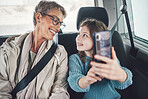 Travel, phone and selfie with girl and grandmother in car for road trip adventure on vacation for holiday, transportation and social media. Happy, smile and vacation with family for internet post
