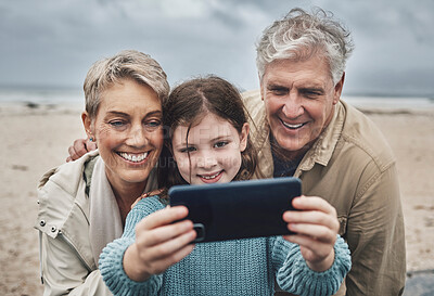 Buy stock photo Phone selfie, beach and grandparents with child bond on relax adventure, fun travel journey or Sydney Australia vacation. Memory picture, love and happy family of grandpa, kid girl and grandma smile