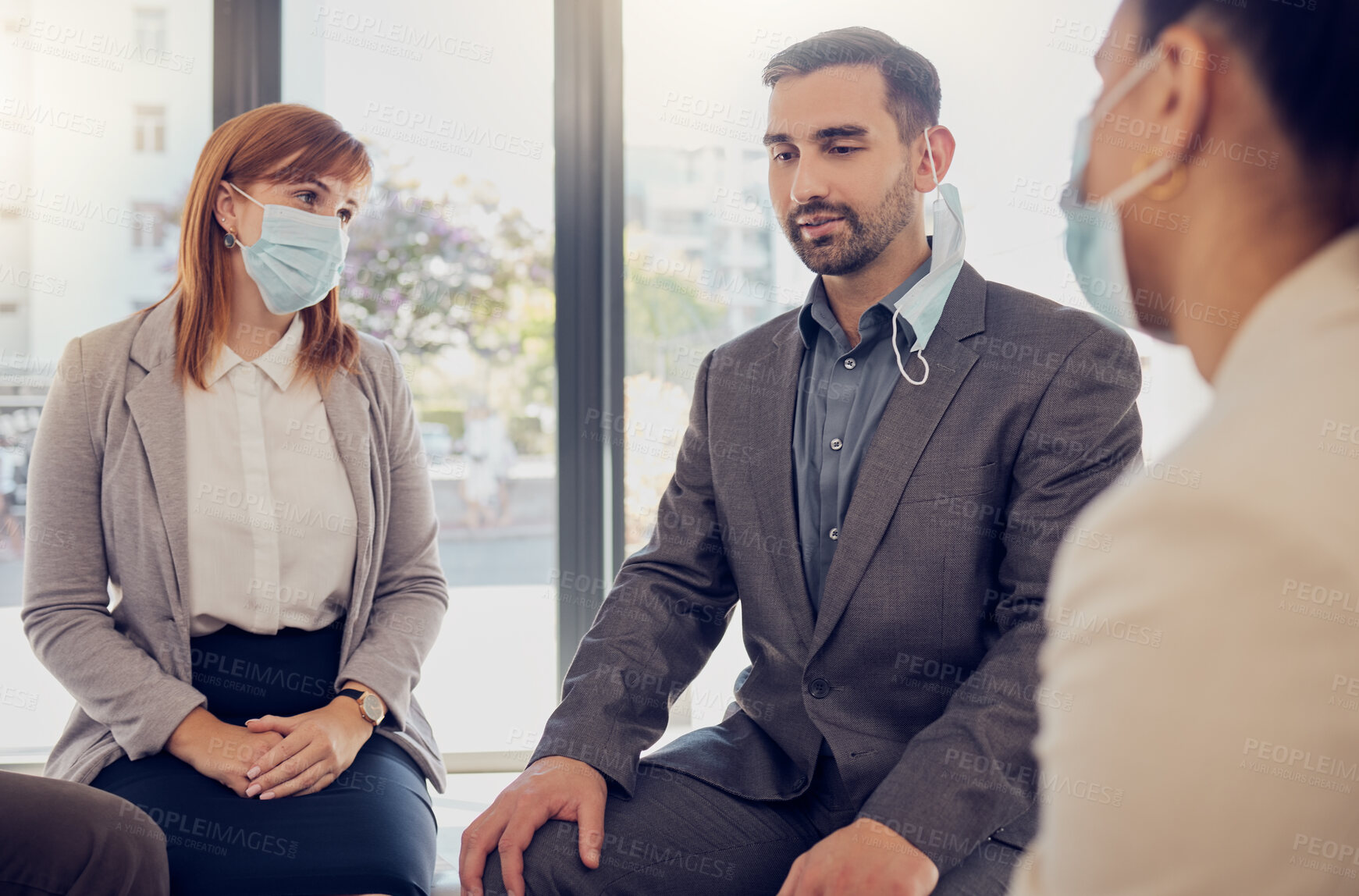 Buy stock photo Covid, business people and office meeting with leader, manager or coach talking for counseling, therapy or support. Corporate women and man group with face mask during coronavirus for development