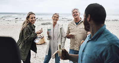 Buy stock photo Big family, beach food and lunch on vacation, holiday or trip outdoors. Love, generations and family eating bananas at sandy seashore, having fun and talking, spending good time together and bonding.