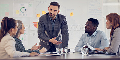 Buy stock photo Businessman, speaker or presentation meeting with paper chart, infographic documents and survey research. Talking mentor, manager or leader in corporate training, diversity teamwork and collaboration