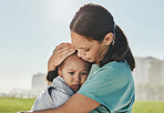 Woman, child and sad with comfort, love and care in hug, embrace and holding outdoor at park. Mom, kid and together for support, attention and help for depression, mental health and problem in sun