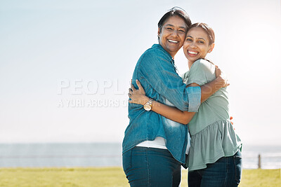 Buy stock photo Love, mother and outdoor adult daughter have hug happy, smile and bonding on vacation, adventure or holiday to embrace, beach or relax together. Portrait, mom and being cheerful, grateful at seaside.