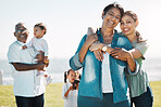 Black family, happy and smile in park with mother, kids and grandparents together in sunshine. Woman, mom and children with grandpa on grass for bonding, portrait and outdoor with happiness in summer