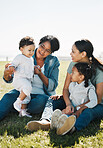 Family, love and park, women and children outdoor on a field of grass, picnic and quality time together in the sun. Mother, grandmother and girl with baby, generations have fun in nature and bonding.