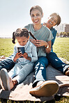 Family, picnic and park with child, mother and grandma sitting together on grass to relax, bond and smile with three generation girls having fun. Portrait of woman, girl kid and senior lady in nature