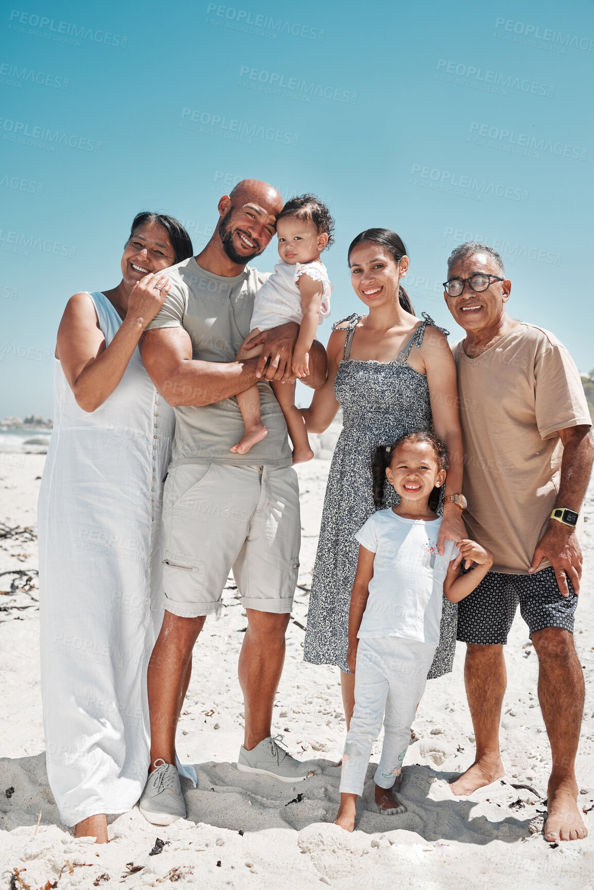 Buy stock photo Big family, portrait and smile on beach holiday, vacation or Mexico summer trip. Generations, parents and children on sandy, sea or ocean shore having fun, bonding and spending quality time together.