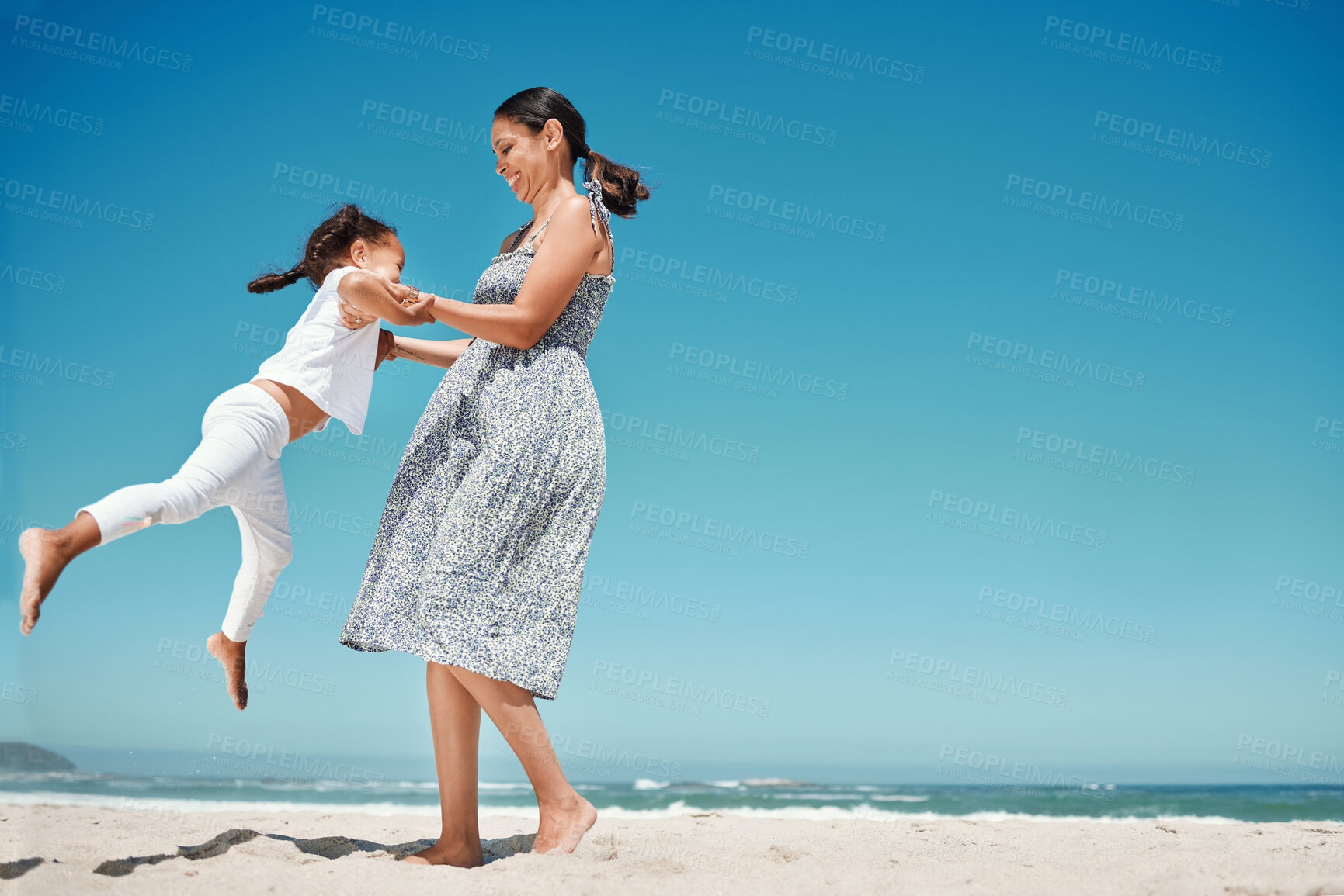 Buy stock photo Beach, summer and mother with child jump in sand on blue sky mock up for holiday celebration, mothers day or outdoor bonding. Happy woman, mom and girl kid celebrate together on ocean island vacation