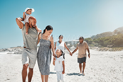 Buy stock photo Travel, summer and big family holding hands at beach and walking on vacation, wellness and support together. Smile, love and relax on sea side holiday with happy parents, children and grandparents 