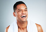 Happy, laugh and face of man clean after wellness wash, facial cleaning routine and skincare mockup. Happiness, smile and person with bath shower towel for body self care isolated on gray background