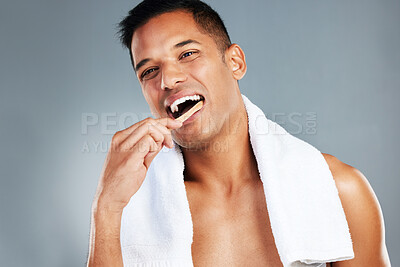 Buy stock photo Man, toothbrush and teeth for dental hygiene in clean, fresh and wash for healthcare against a grey studio background. Portrait of a toothy male brushing mouth for oral and gum care treatment