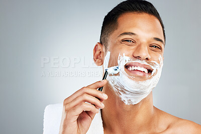 Buy stock photo Skincare, facial and man shaving beard or face hair for cleaning cream and razor. Happy latino male shave, handsome and epilation care of skin during morning routine for beauty and hygiene wellness 
