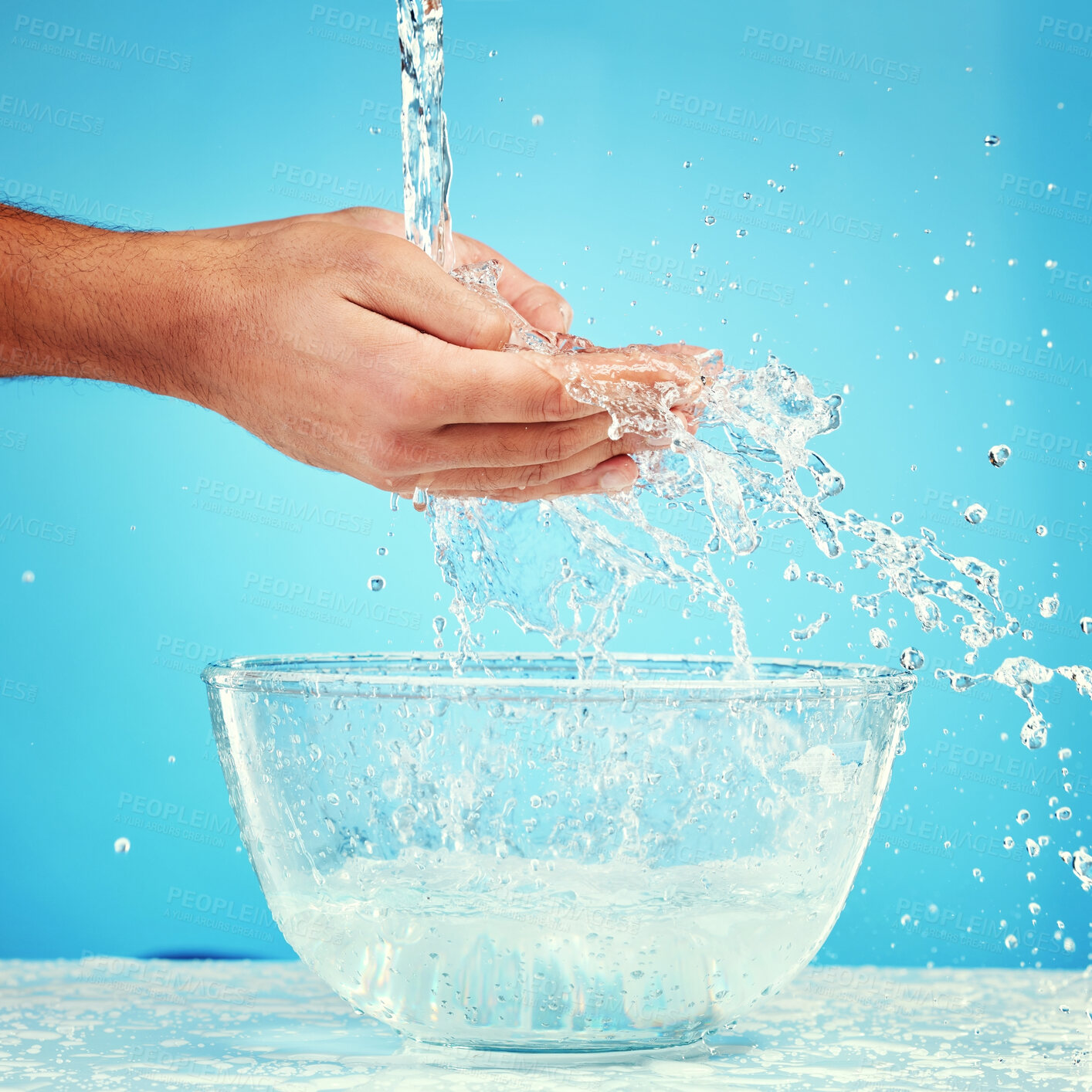 Buy stock photo Water bowl, health and hands splash liquid for hygiene, cleaning and wellness beauty routine with mockup. Water splash container, skincare and wet palm of self care man isolated on blue background