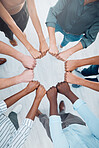 Business people teamwork, fist bump and collaboration, cooperation and trust, goals and support. Above workers hands, diversity team building circle and commitment, vision and job mission of about us