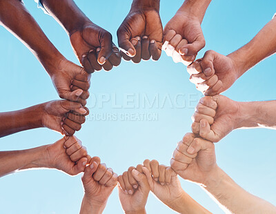 Buy stock photo Fist hands, circle and diversity support human rights people, protest group and freedom of racism on blue sky background. Below solidarity, partnership and motivation of goals, trust or world justice