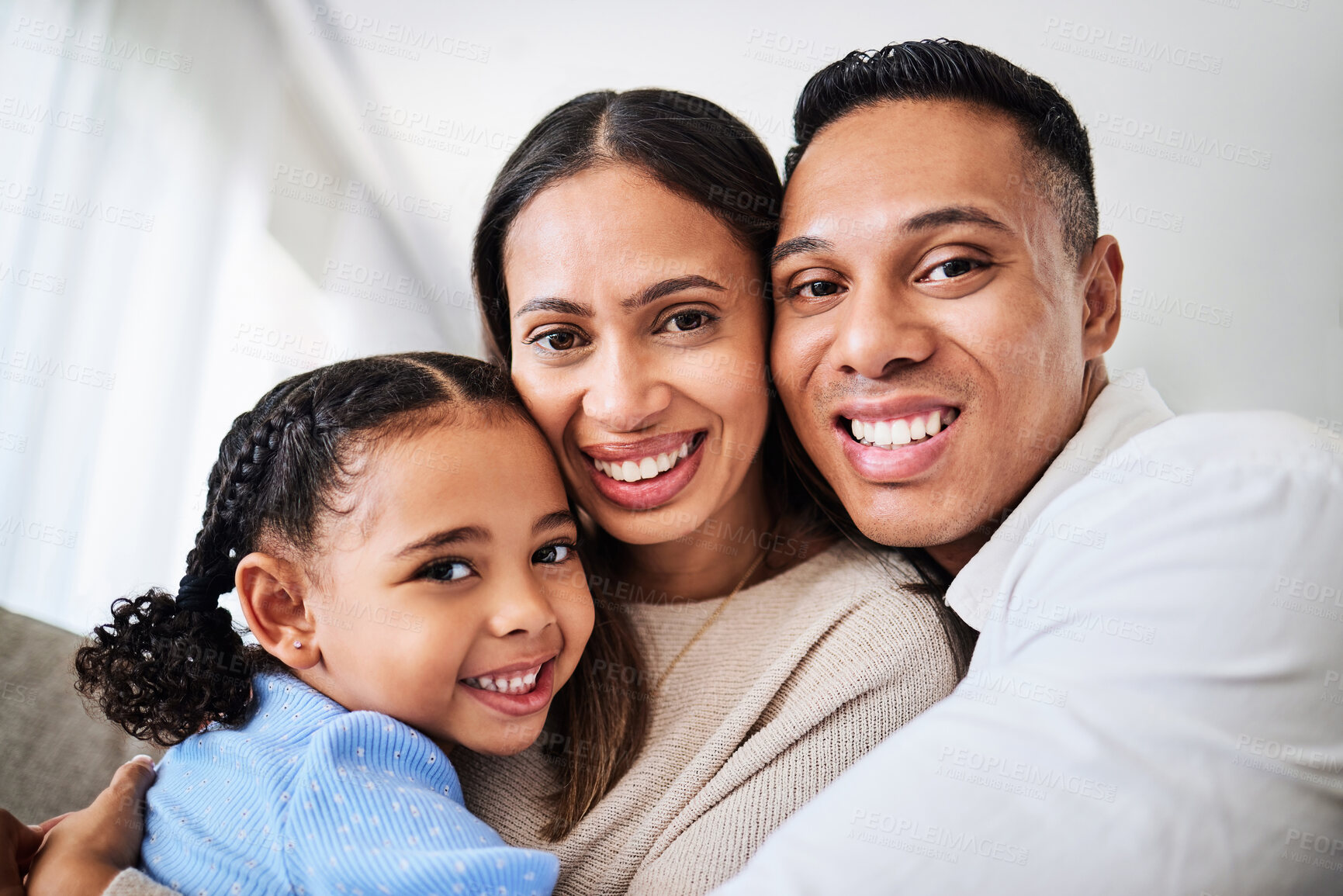 Buy stock photo Family, happy and face portrait in living room home, smiling and bonding. Love, care and happy parents, child or girl hugging, embrace or spending quality time together in house with smile or support