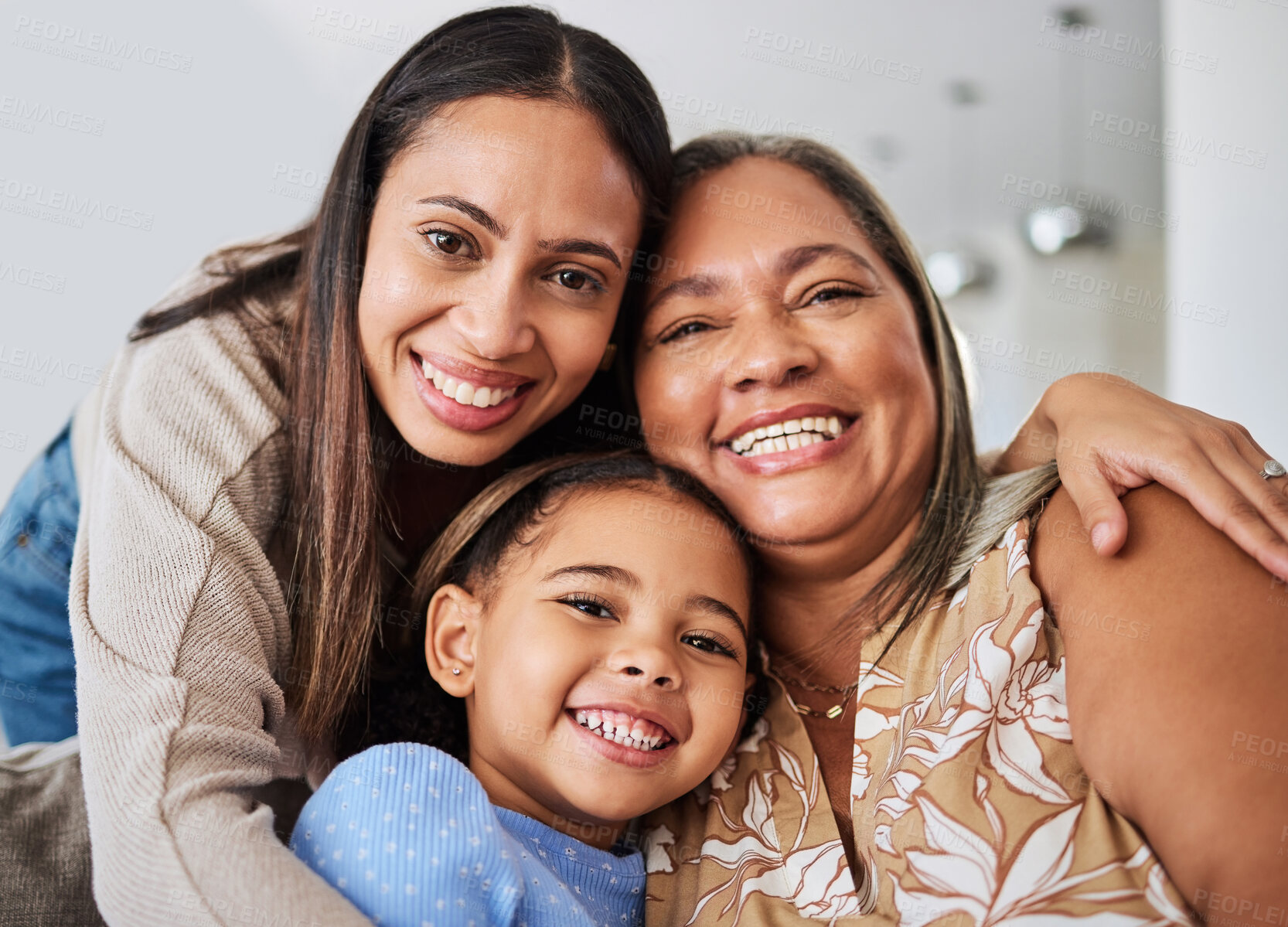 Buy stock photo Love, family and portrait of multigenerational women on a sofa, relax, happy and bonding in a living room. Portrait, mother, girl and grandma smile, hug and relaxing on a couch enjoying quality time