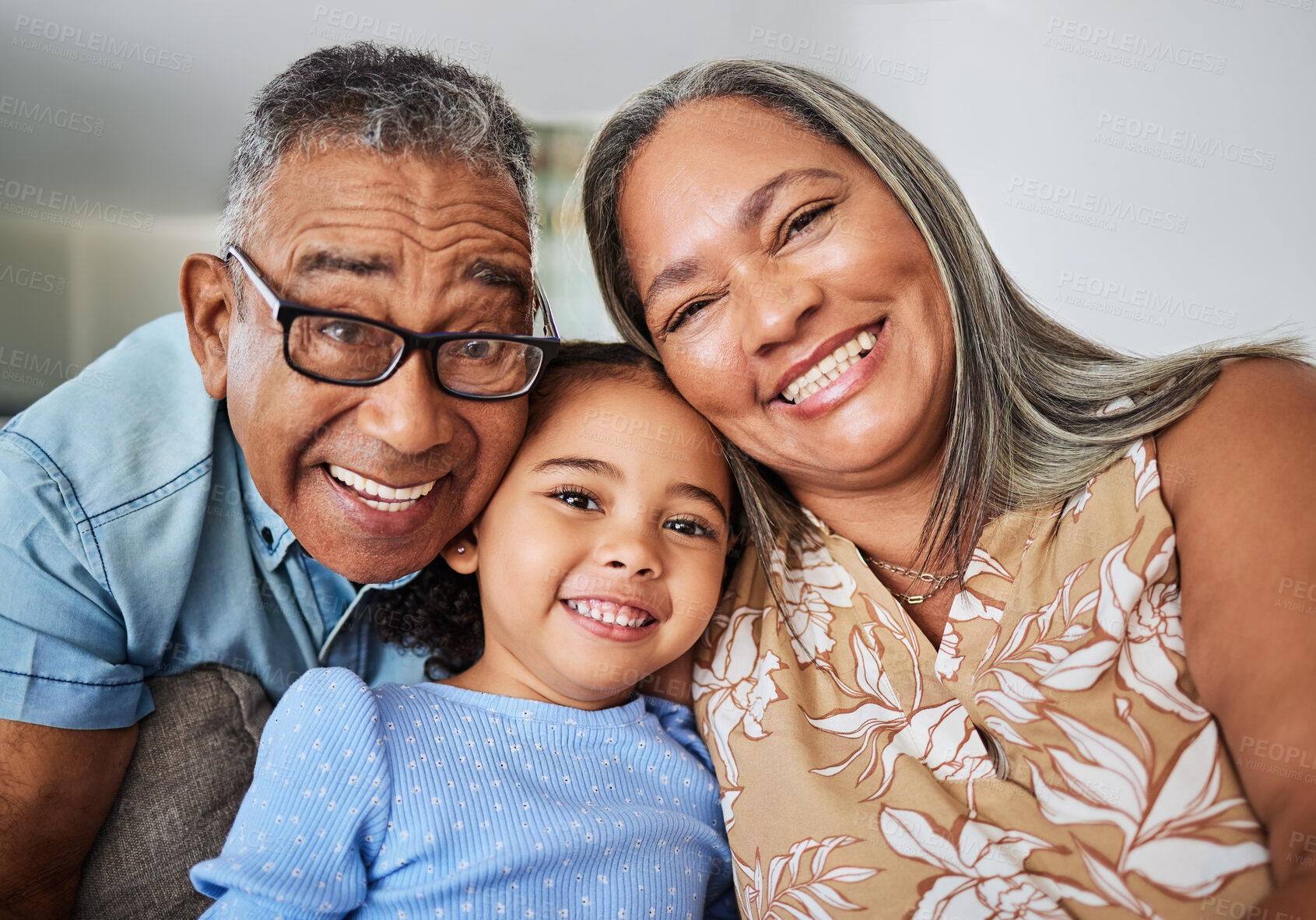 Buy stock photo Family, grandparents and child portrait in a house relaxing, bonding and having fun in retirement on a weekend. Smile, grandma and grandpa hugging and enjoy quality time with a happy girl in Bogota