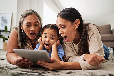 Buy stock photo Digital tablet, family and wow in a living room with multigenerational women bonding on a floor, surprised, shock and excited. Relax, happy family and good news with mother, girl and grandma online