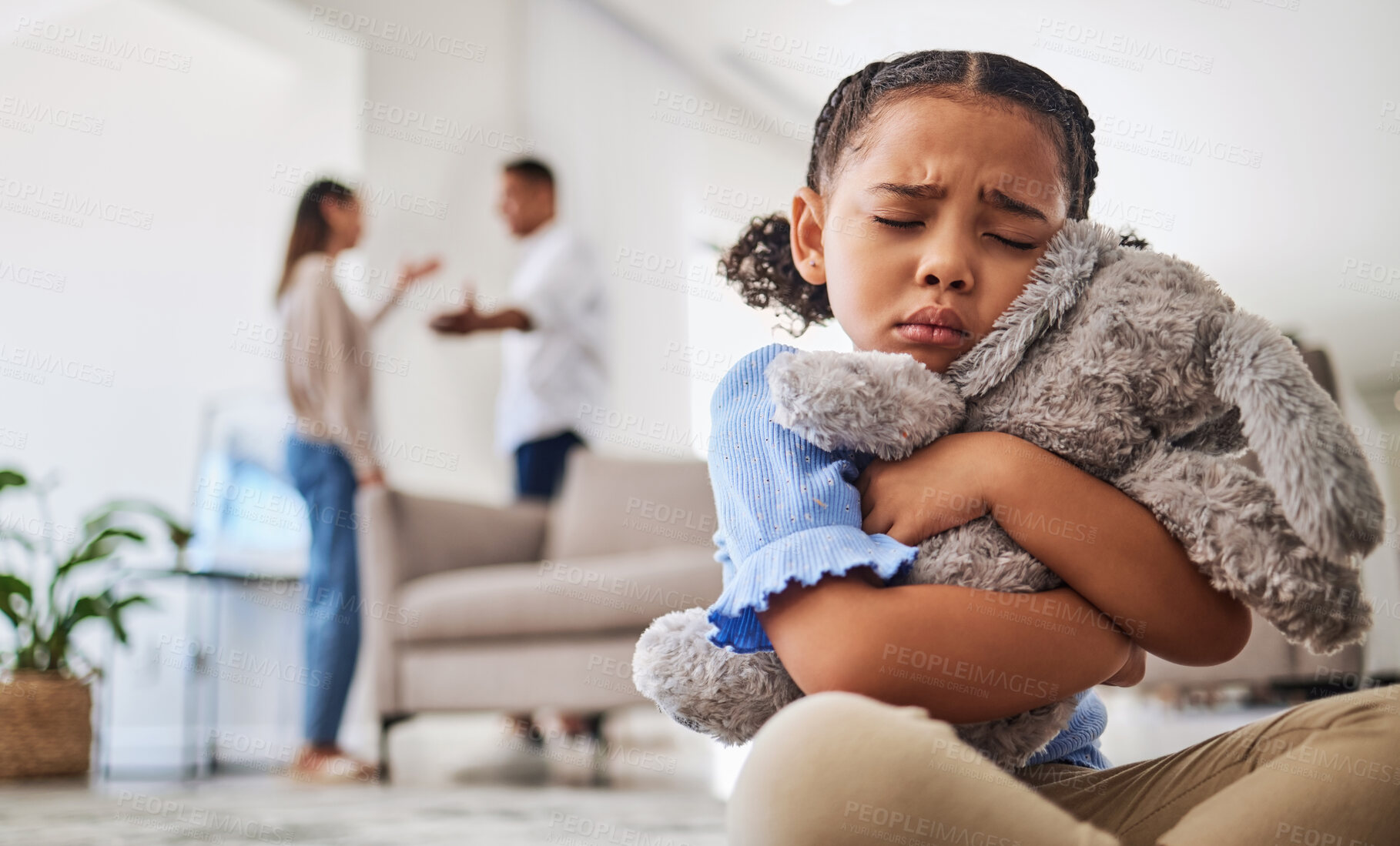 Buy stock photo Parents fight, sad girl and teddy hug of a child crying from divorce in a home living room. Depressed kid, problem and youth anxiety of children depression from mama and dad family fighting 